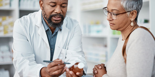 A pharmacist discussing medications with a customer